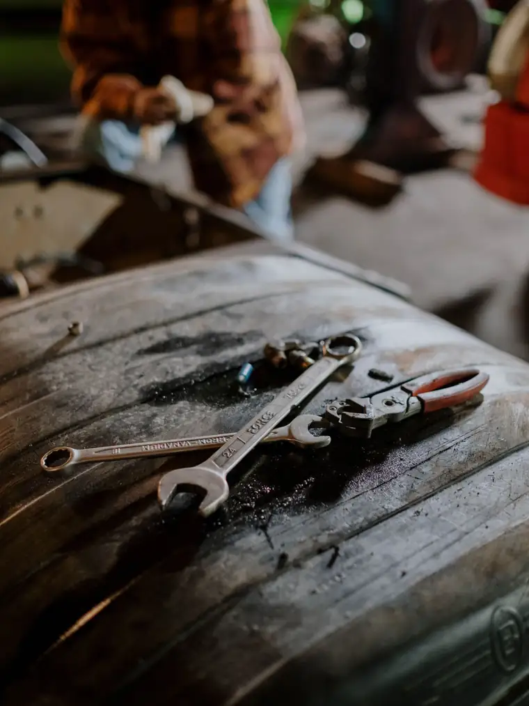 Pipe wrenches and pliers on a working bench