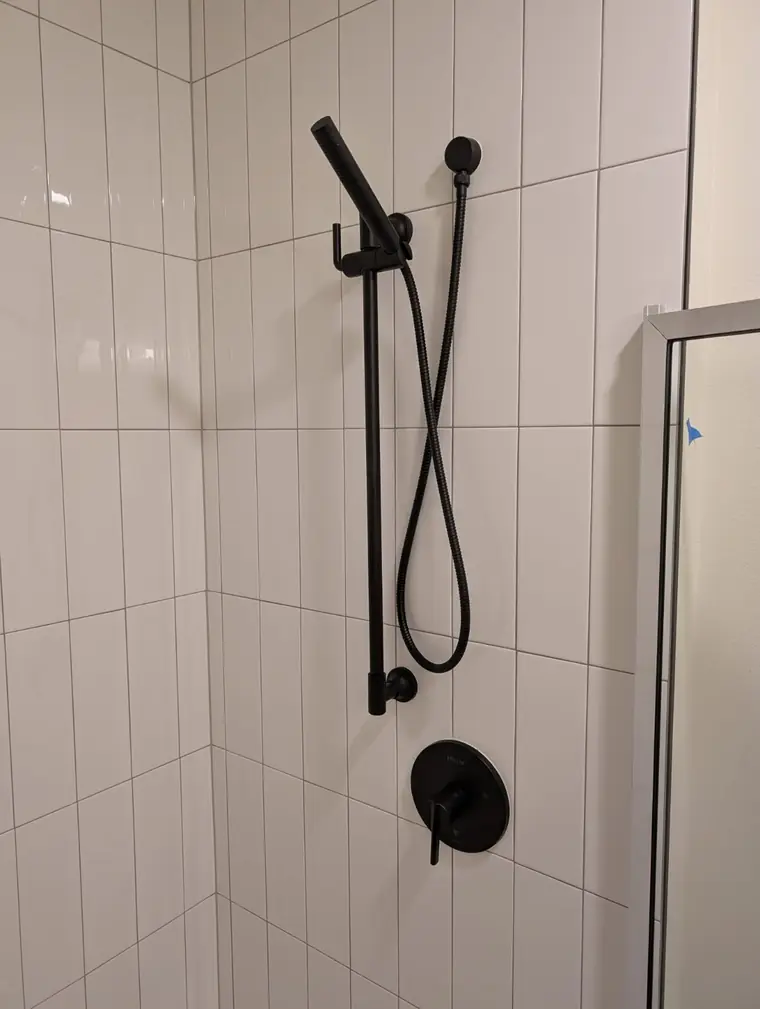 Matte black shower valve and hand-held slide bar installed on Camano Island