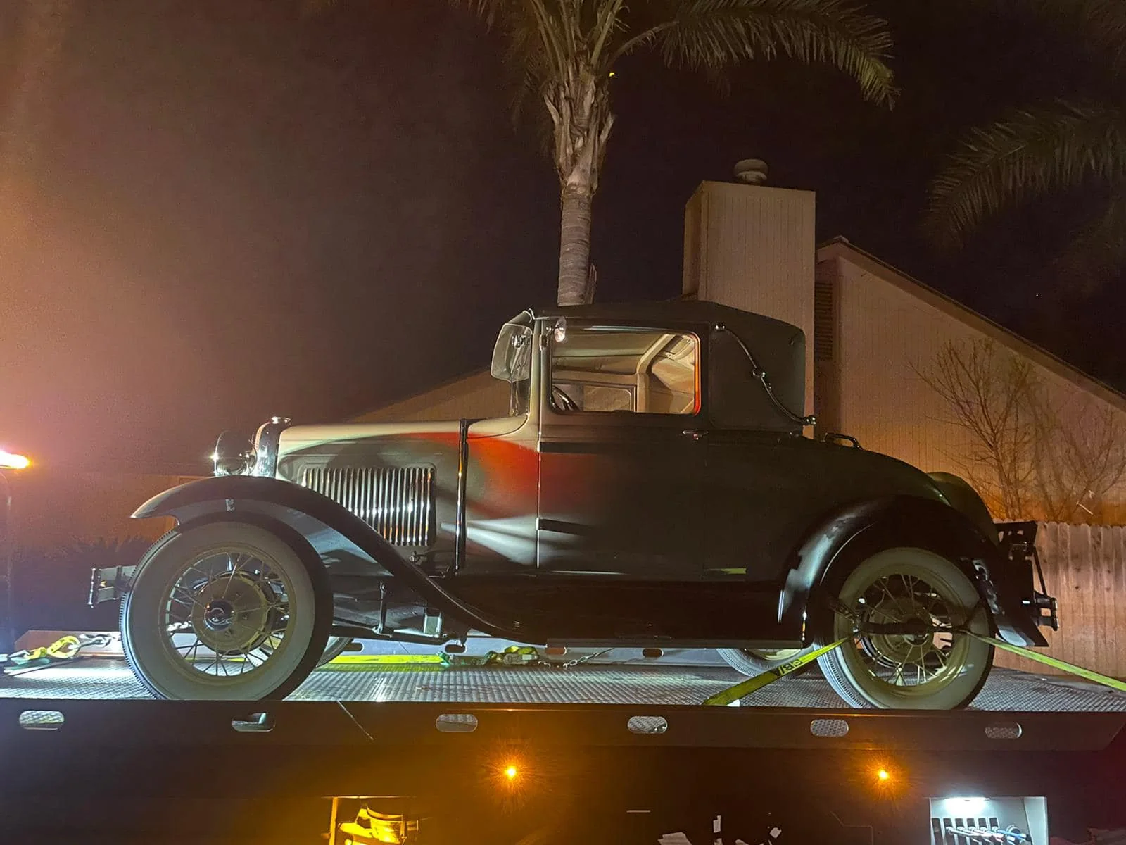 Vintage hot rod loaded for nighttime transport